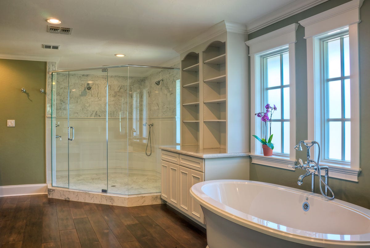 Full room master bath with white shelving and walk in shower