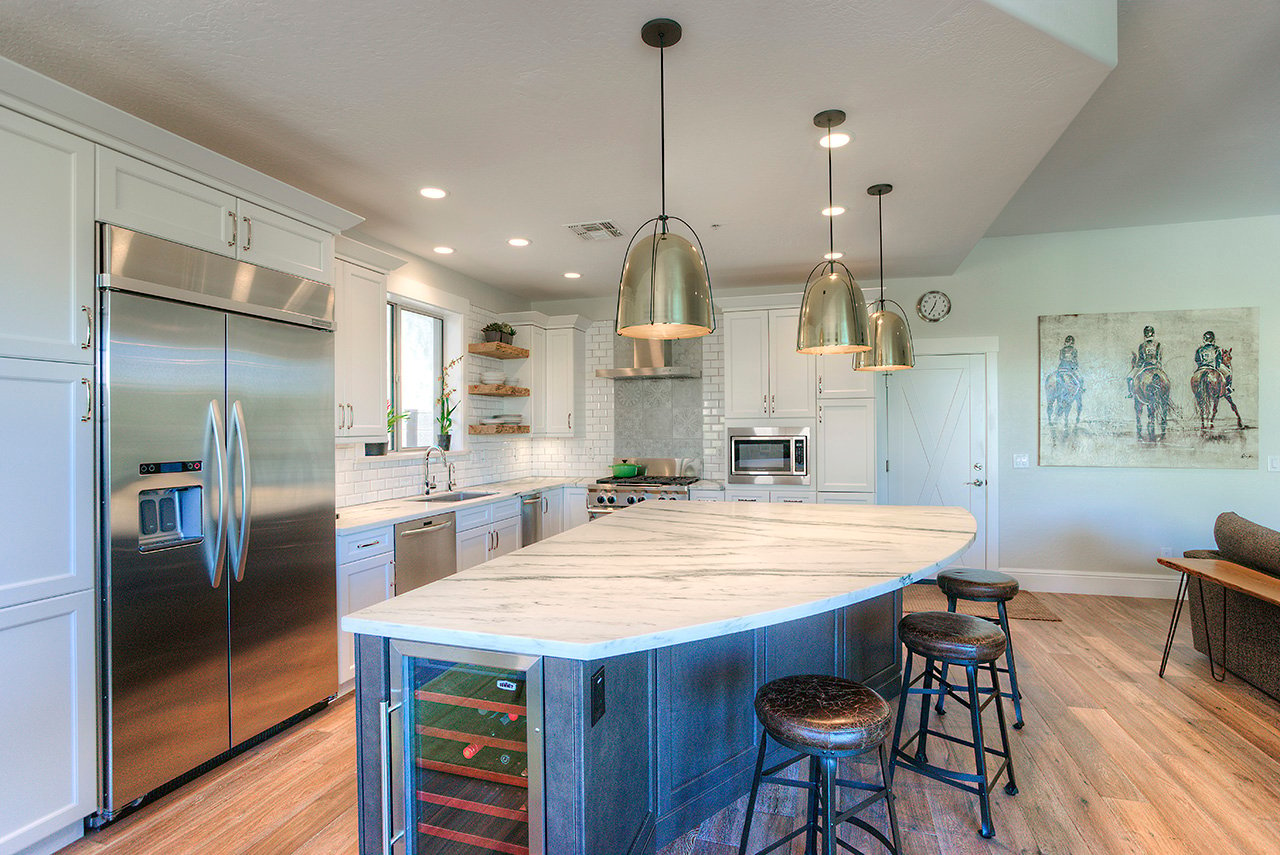 Kitchen island with wine storage and bar stool seating