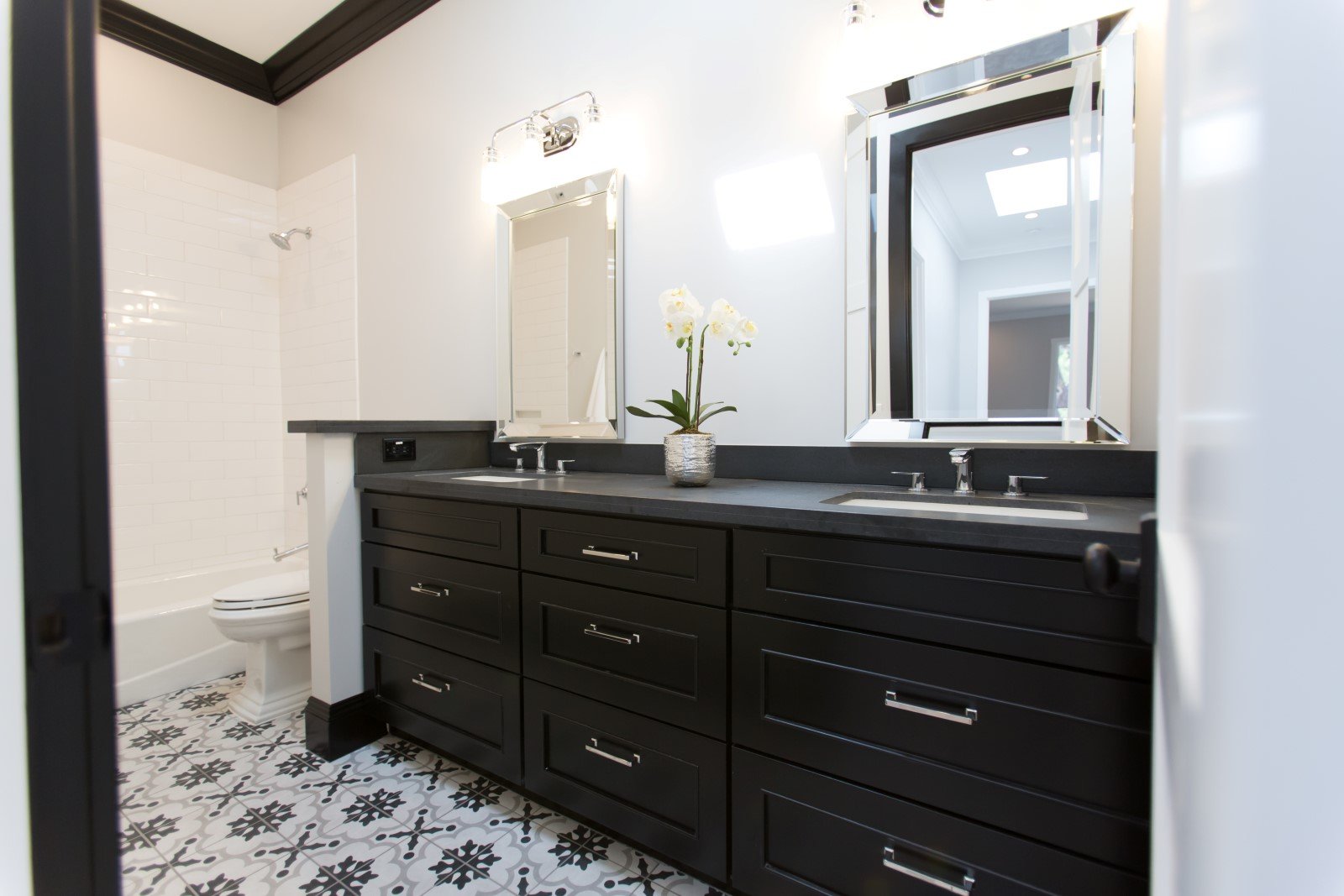 Black Cabinetry And Double Vanity Bathroom