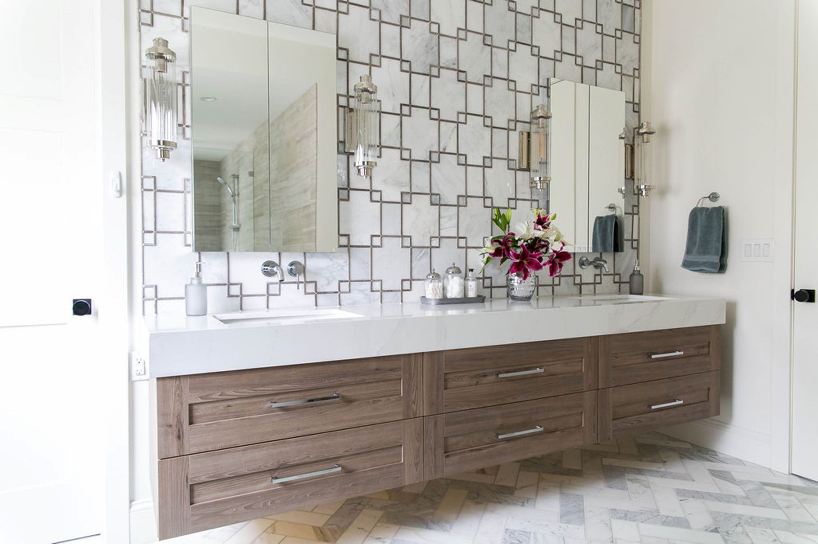 Bathroom with decorative wall design and double vanity