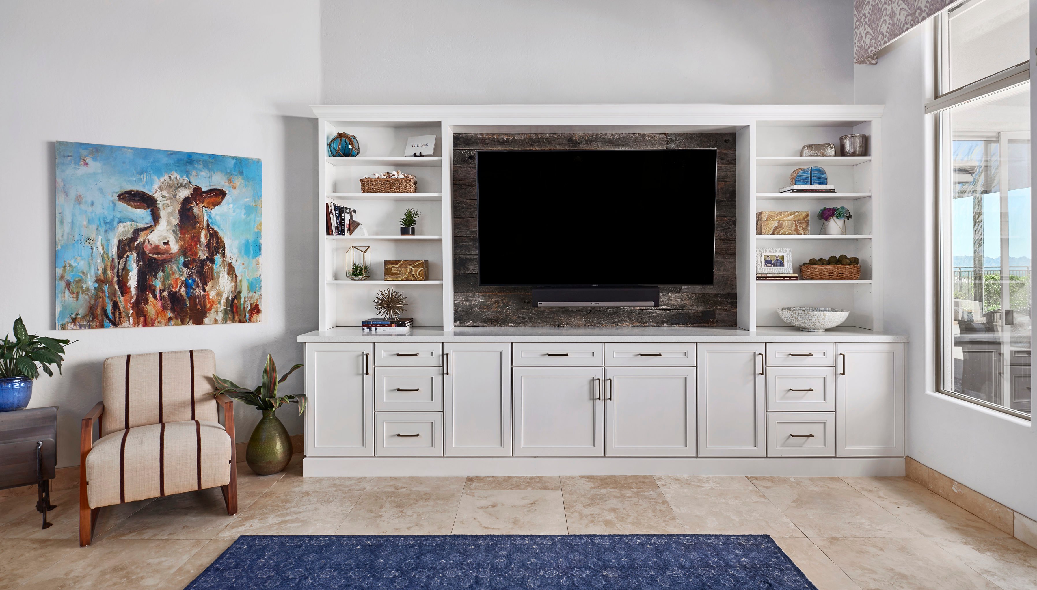 Family room TV stand with white cabinetry and hutch