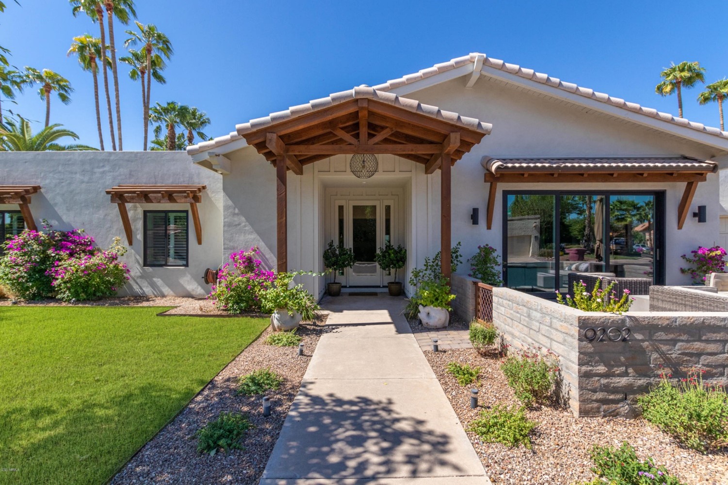 Front of a home with a pergola entry